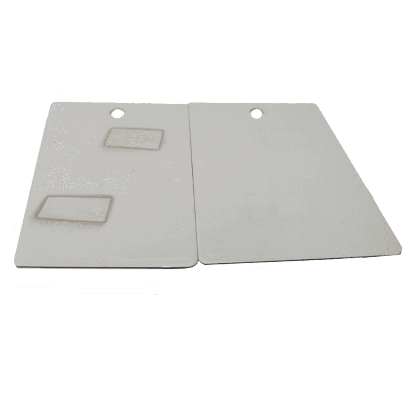 Two beige Staining ASTM D925 with cut-out handles on a white background