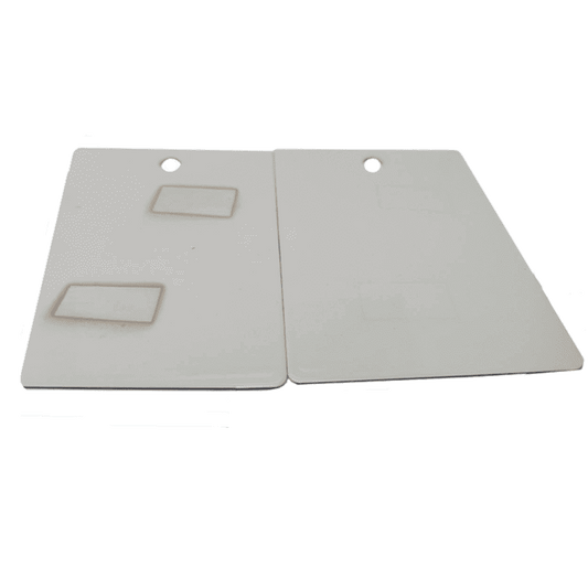 Two beige Staining ASTM D925 with cut-out handles on a white background